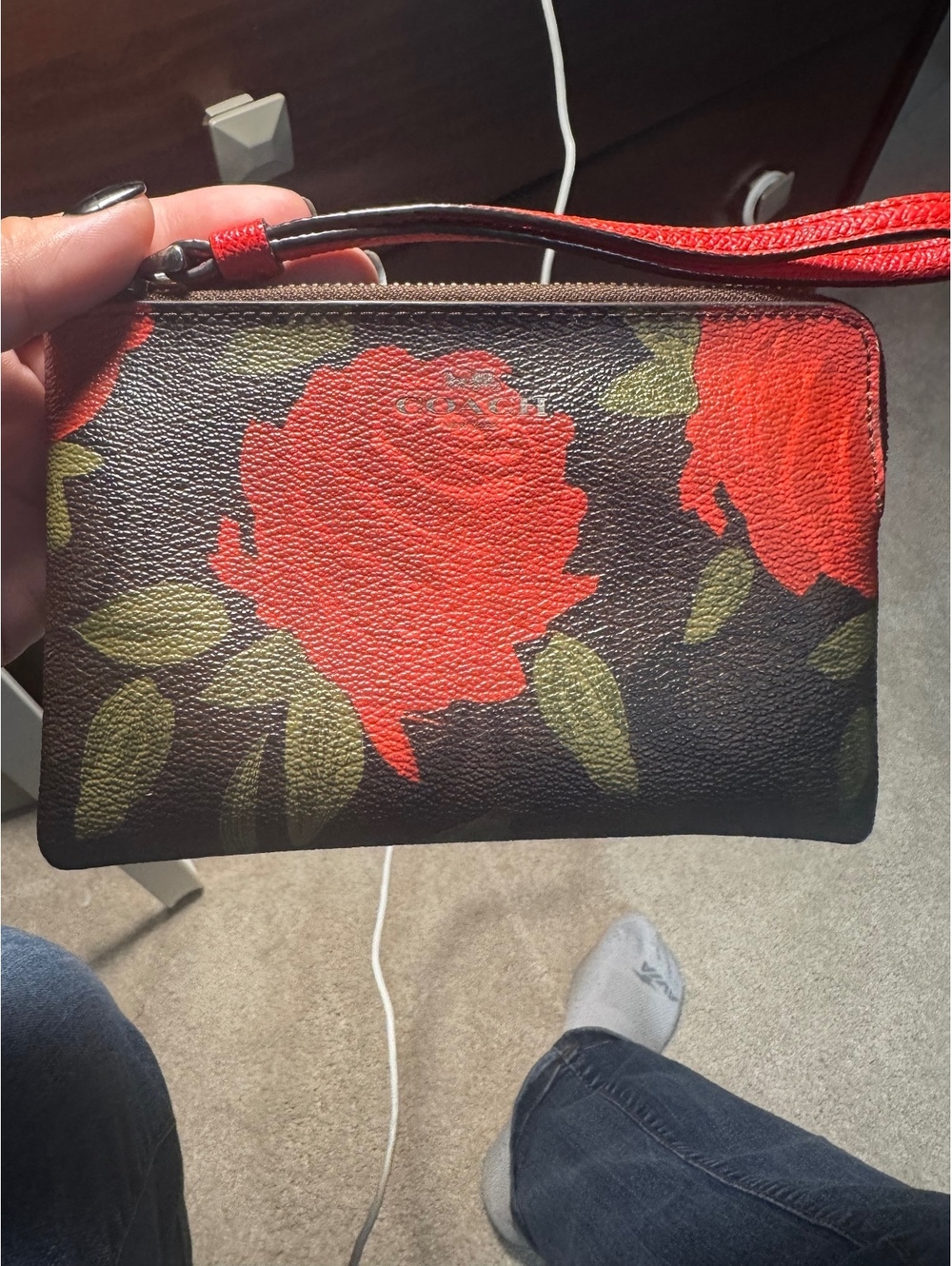 C48. Coach floral wristlet